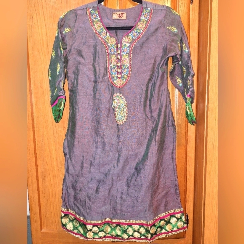 An Ornate Kala Kurti/Kafka/Kaftan with embroidery and silk accents.